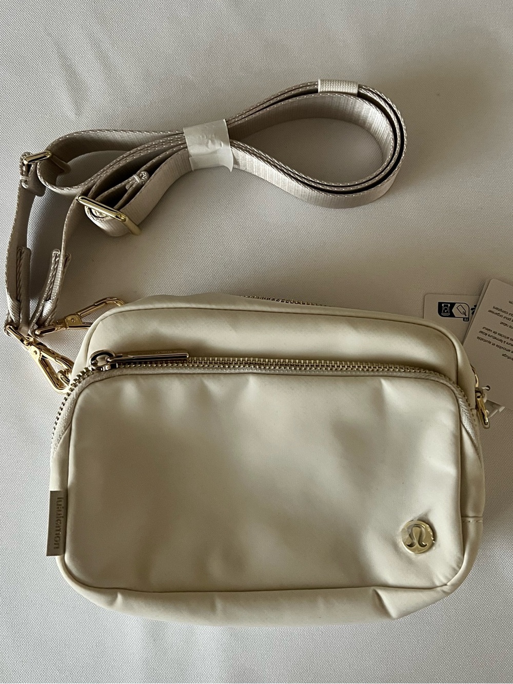 lululemon athletica Ivory Crossbody Bag with Gold Hardware